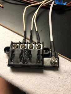 This is the new fuse blocks. Very neat with a common bus. This block will supply fused power to all items that require power when the ignition is turned on, hence the white cables.